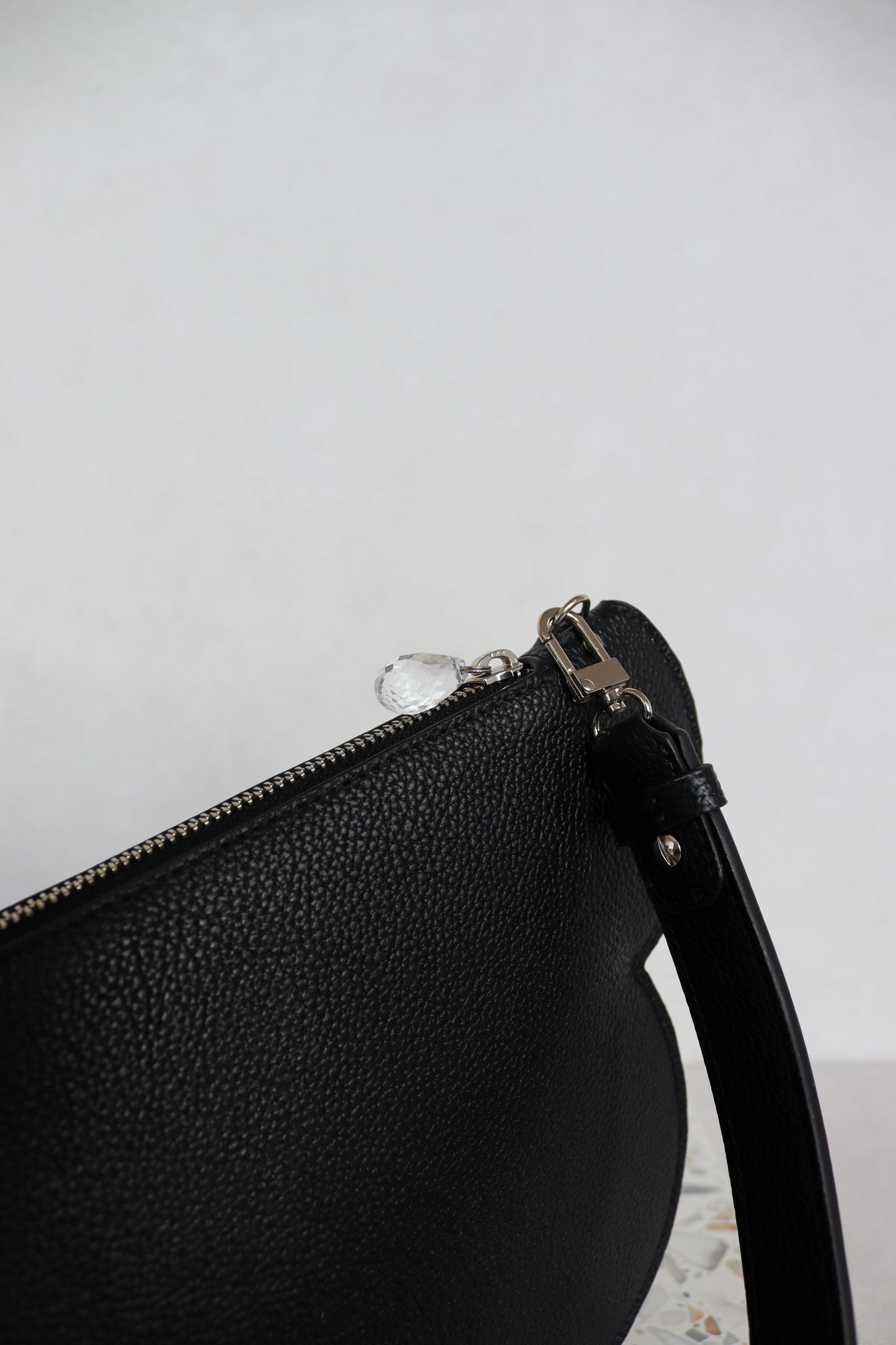 Clutch bag with removable strap in black with crystal studs