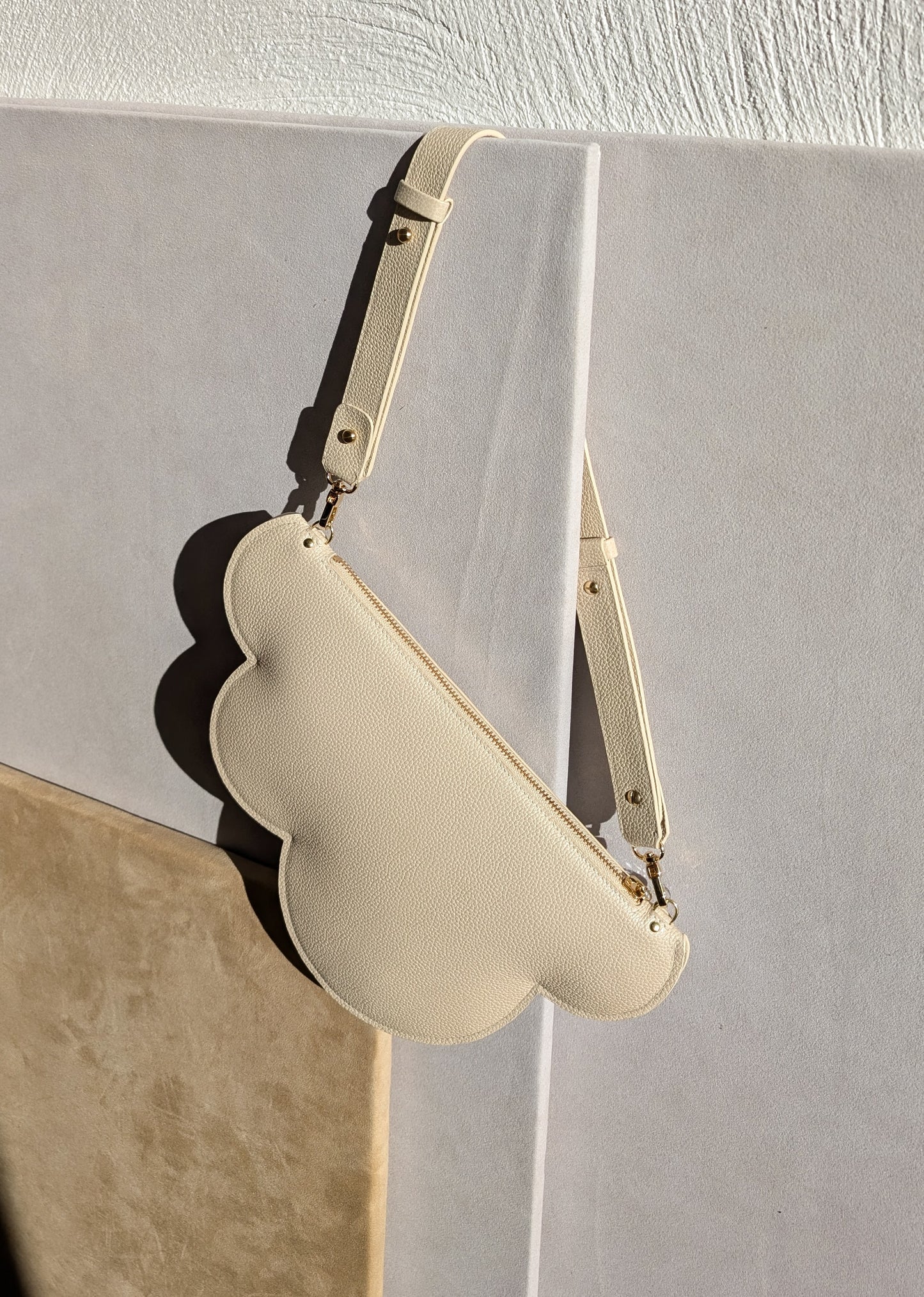 Clutch bag with removable strap in ivory