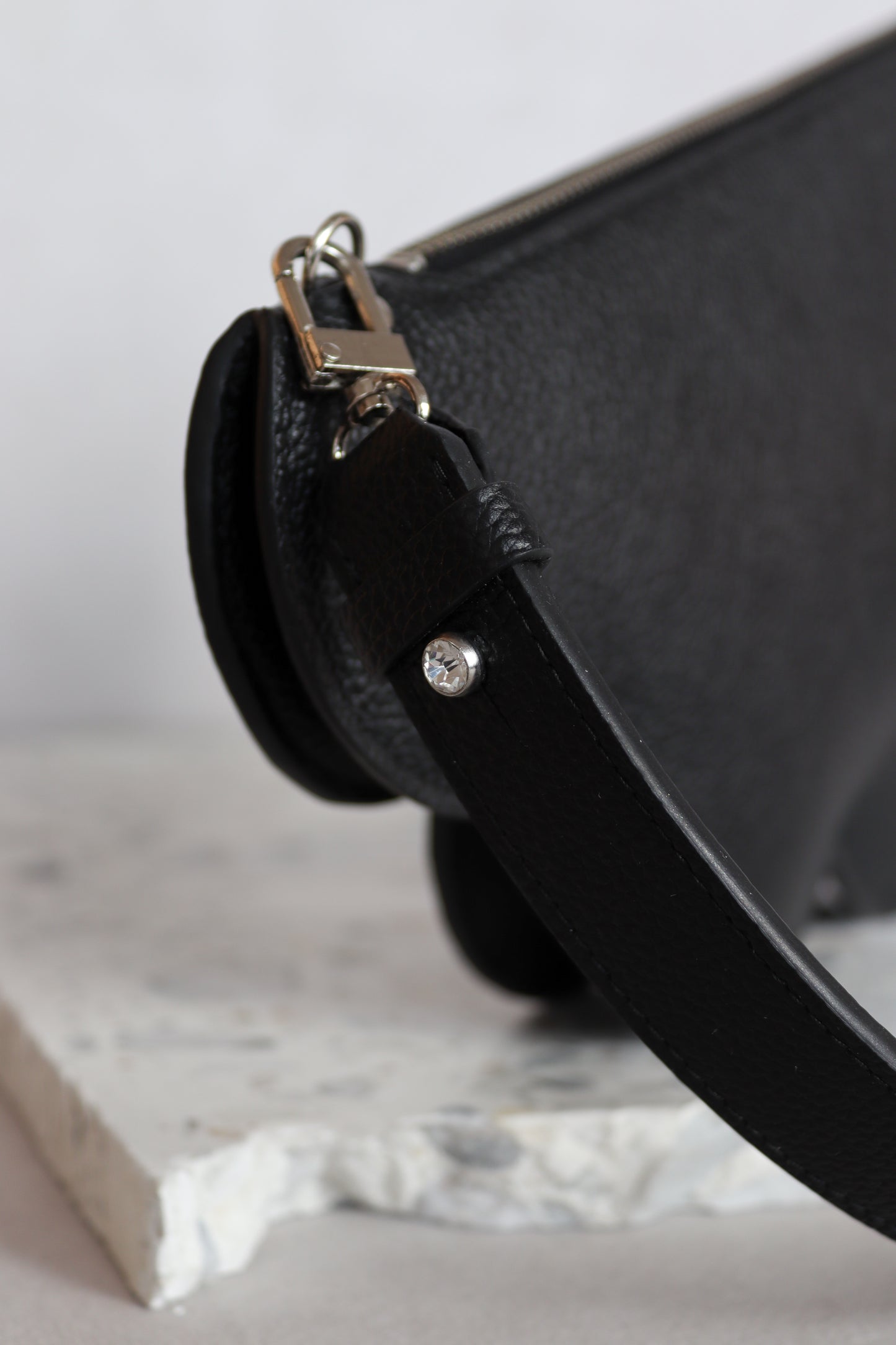 Clutch bag with removable strap in black with crystal studs