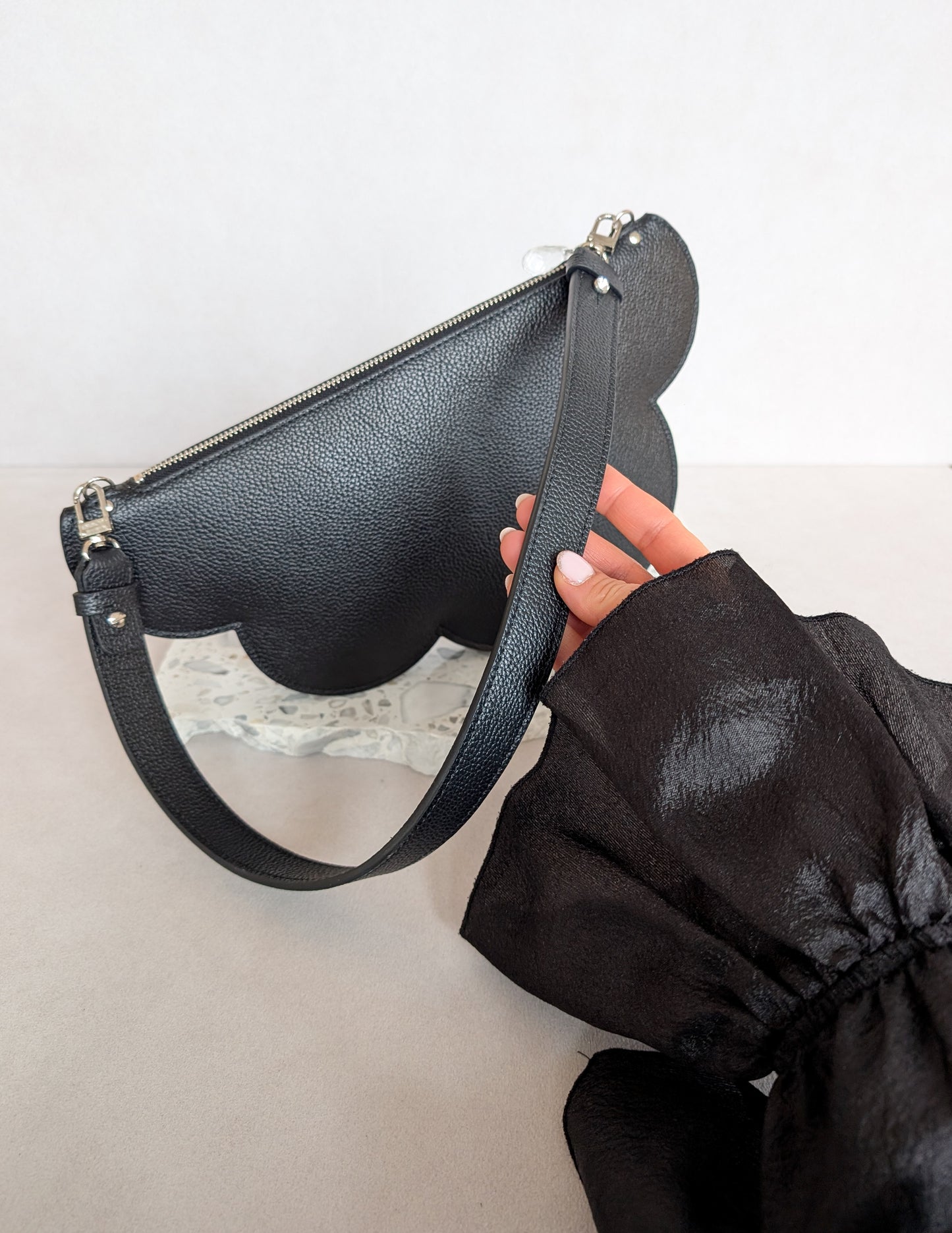 Clutch bag with removable strap in black with crystal studs